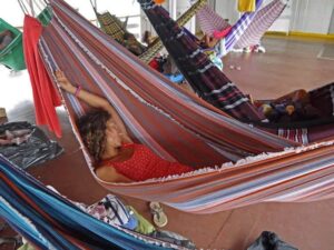 Alya in her hammock slowboat down the Amazon