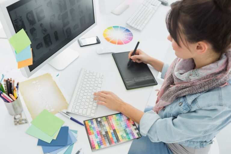 A Woman Using A Stylus On A Computer