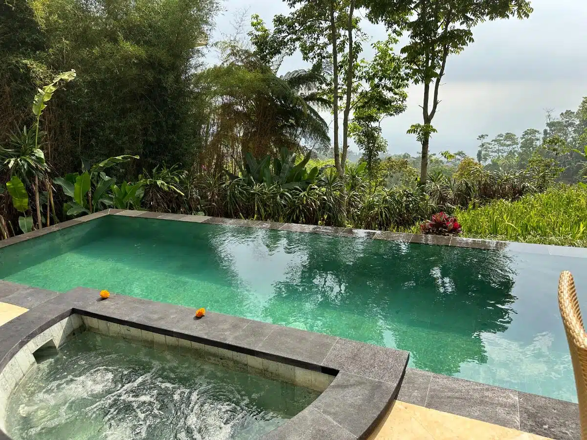 Scenic Resort Grounds With Stone Pathway, Tropical Plants, And Plantation Views At Munduk Moding Plantation, Munduk, North Bali