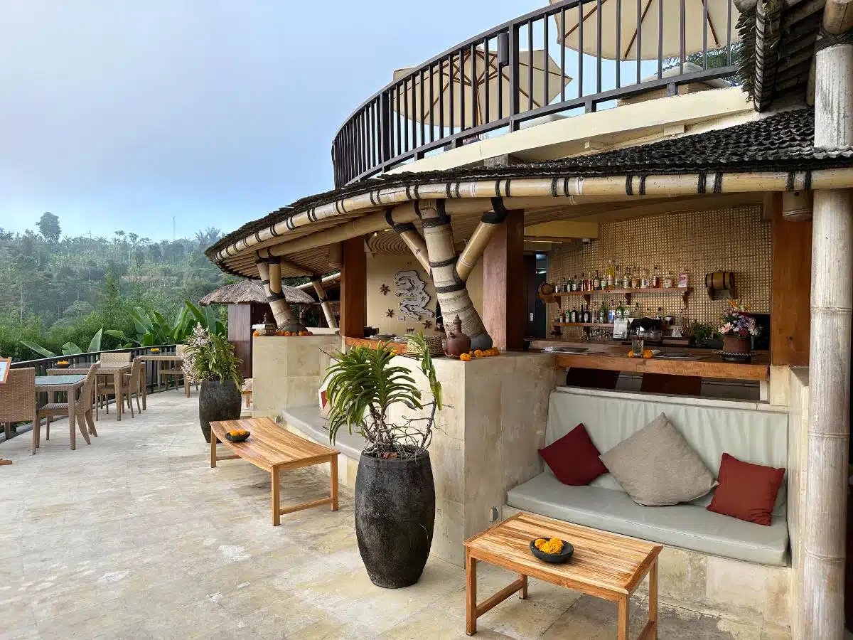 Sunset Bar At Munduk Moding Plantation With Guests Enjoying Drinks And Views Of The Lower Infinity Pool