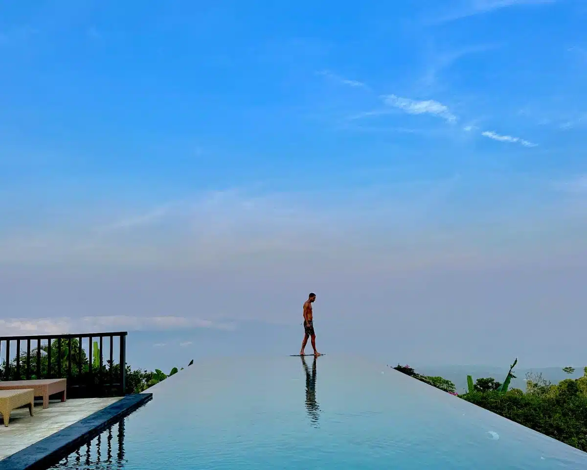 Aerial View Of The Two Infinity Pools With Tropical Gardens And Hillside Villas At Munduk Moding Plantation, North Bali