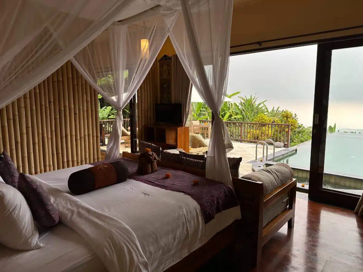 Canopy King Bed With Bamboo Wall Paneling Overlooking The Private Pool Through Glass Doors At Munduk Moding Plantation Pool Villa, Bali