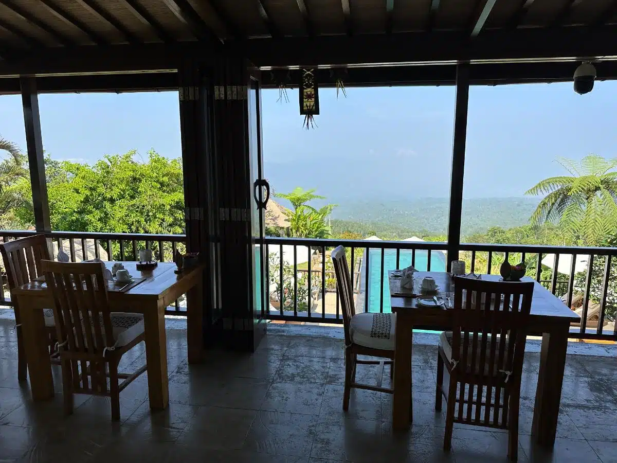 Mimpi Restaurant Upper Floor With Teak Dining Tables Overlooking The Infinity Pool And North Bali Forest At Munduk Moding Plantation