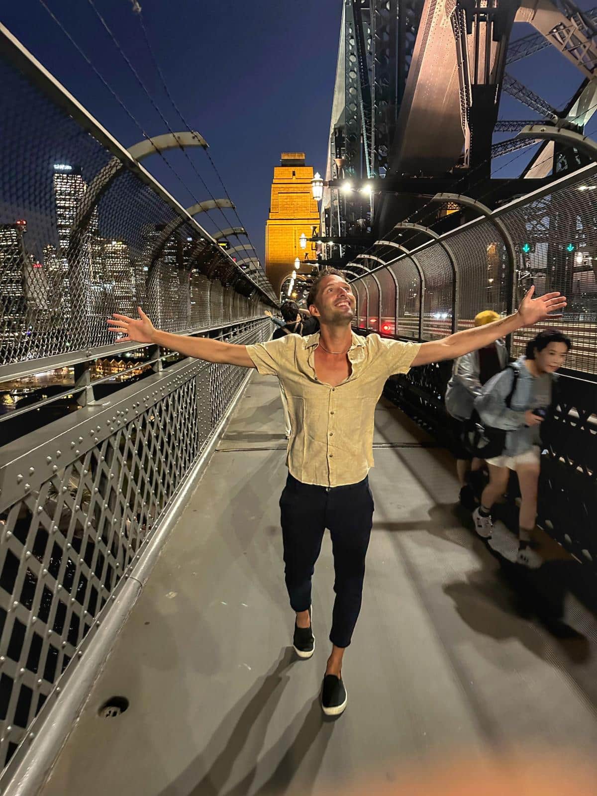 Tim Kroeger On The Pedestrian Walkway Of The Sydney Harbour Bridge At Dusk