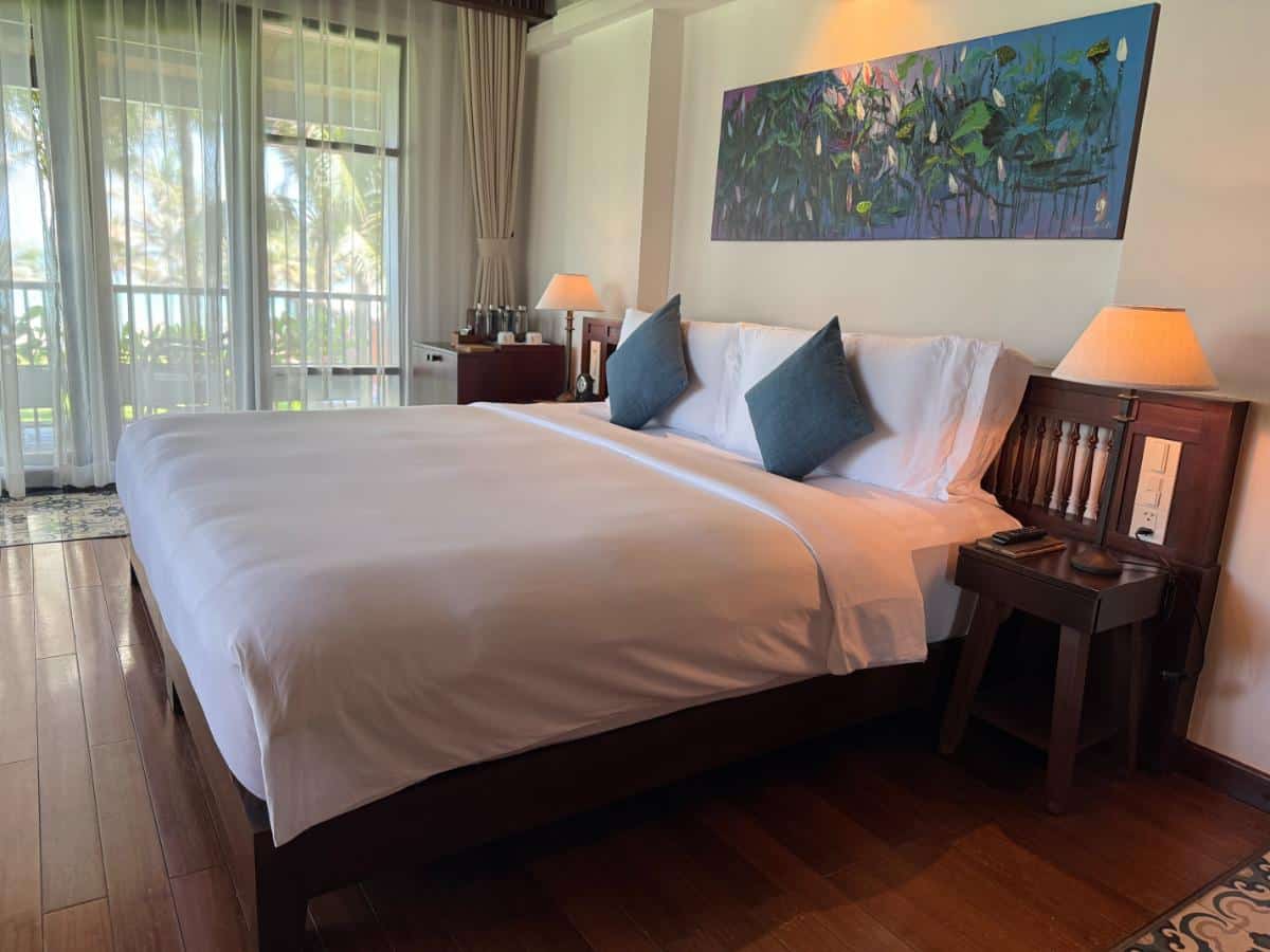 Spacious Sea View Villa Bedroom With King-Sized Bed And Teak Wood Furnishings At The Anam Cam Ranh