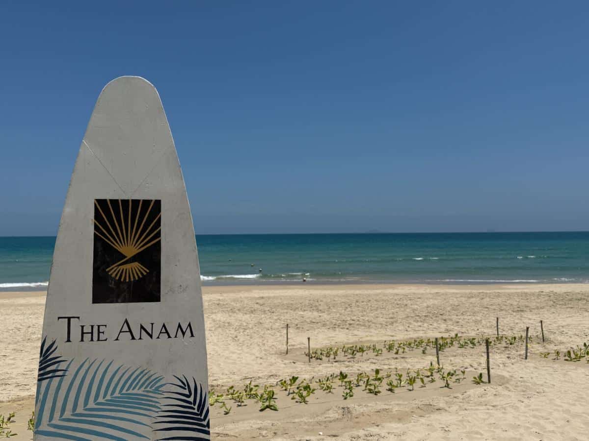 Sandy Beach With Sun Loungers And Calm Cam Ranh Bay Waters At The Anam Resort Vietnam