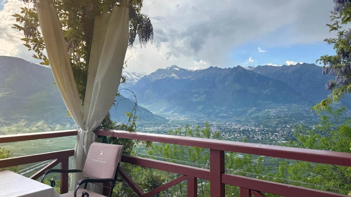 Panoramic View Of The Merano Valley And Snowcapped Alps From The Balcony At Castel Fragsburg Relais &Amp; Châteaux Hotel, South Tyrol, Italy
