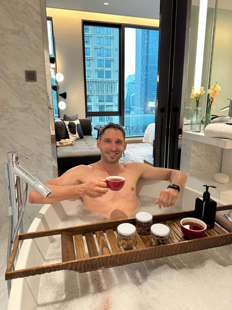 Tim Kroeger In The Sindhorn Suite Bathtub At Kimpton Maa-Lai Bangkok