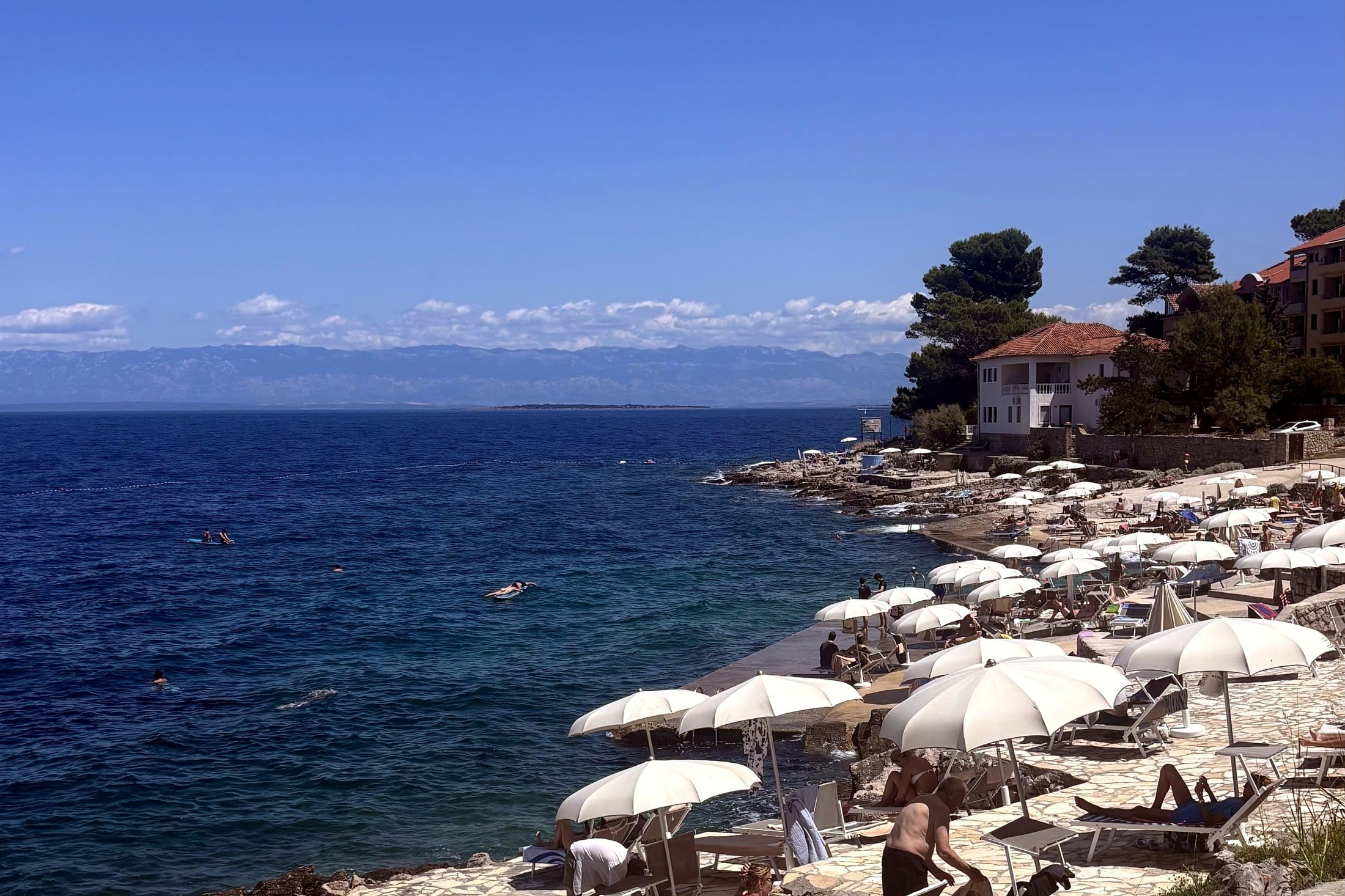 Coastline And Umbrellas On Lošinj, Croatia